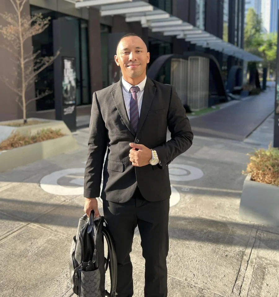 Raymund Libre, licensed real estate broker and appraiser, in a business portrait outside a Davao City office tower