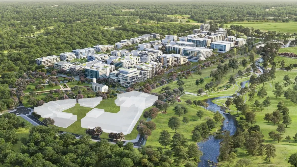 Aerial view of a master-planned residential community with parks and tree-lined roads