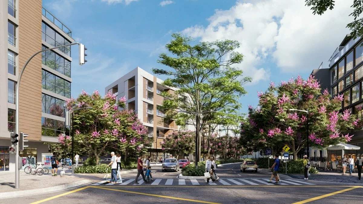 Tree-lined street of mid-rise residences with landscaped frontage